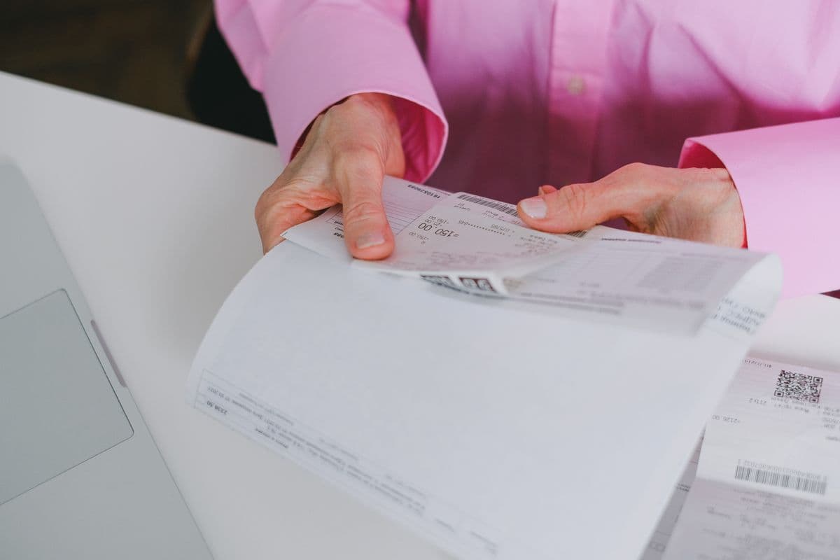 Business professional organizing paper receipts