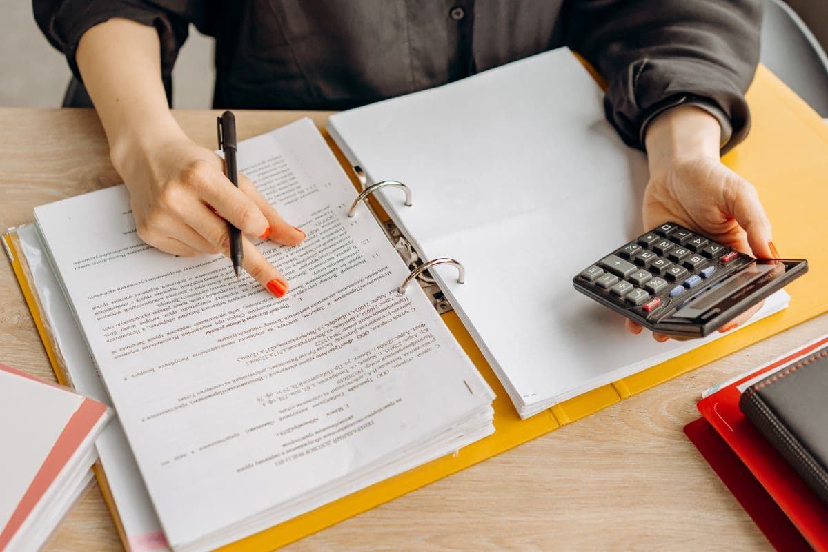 Accountant reviewing financial reports and documents
