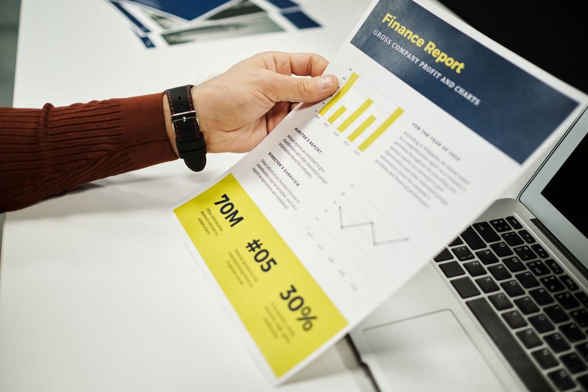 Analyst reviewing financial charts and revenue figures