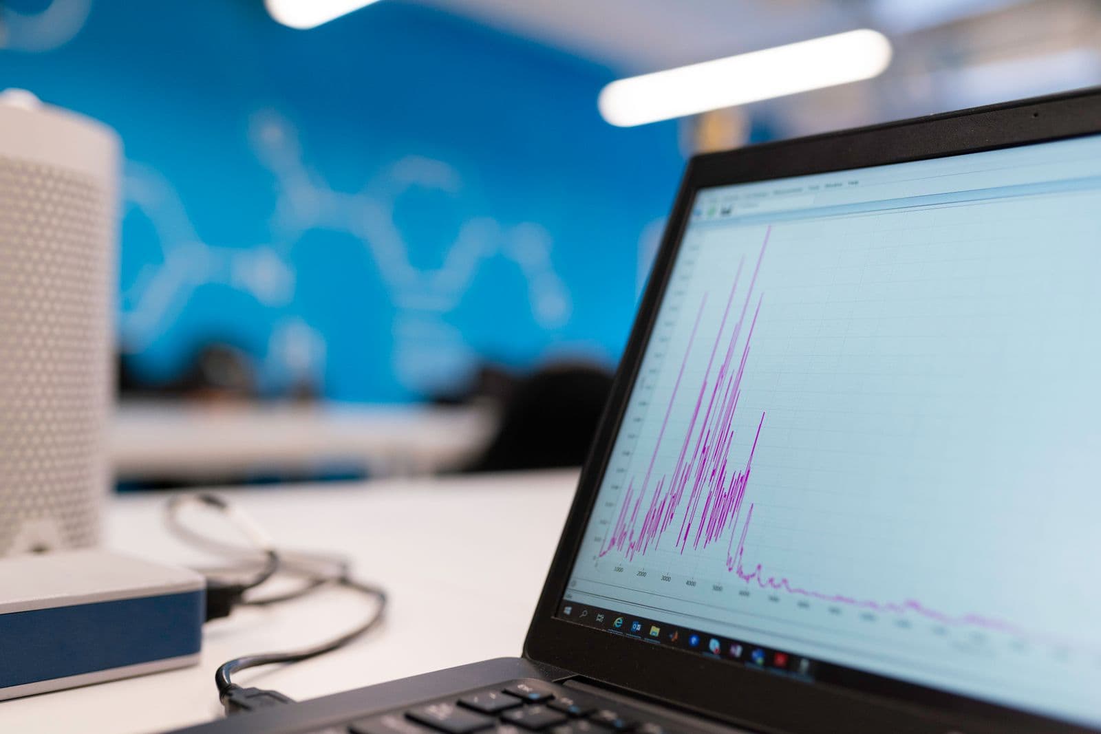Marketer analyzing SEO keyword rankings on a laptop