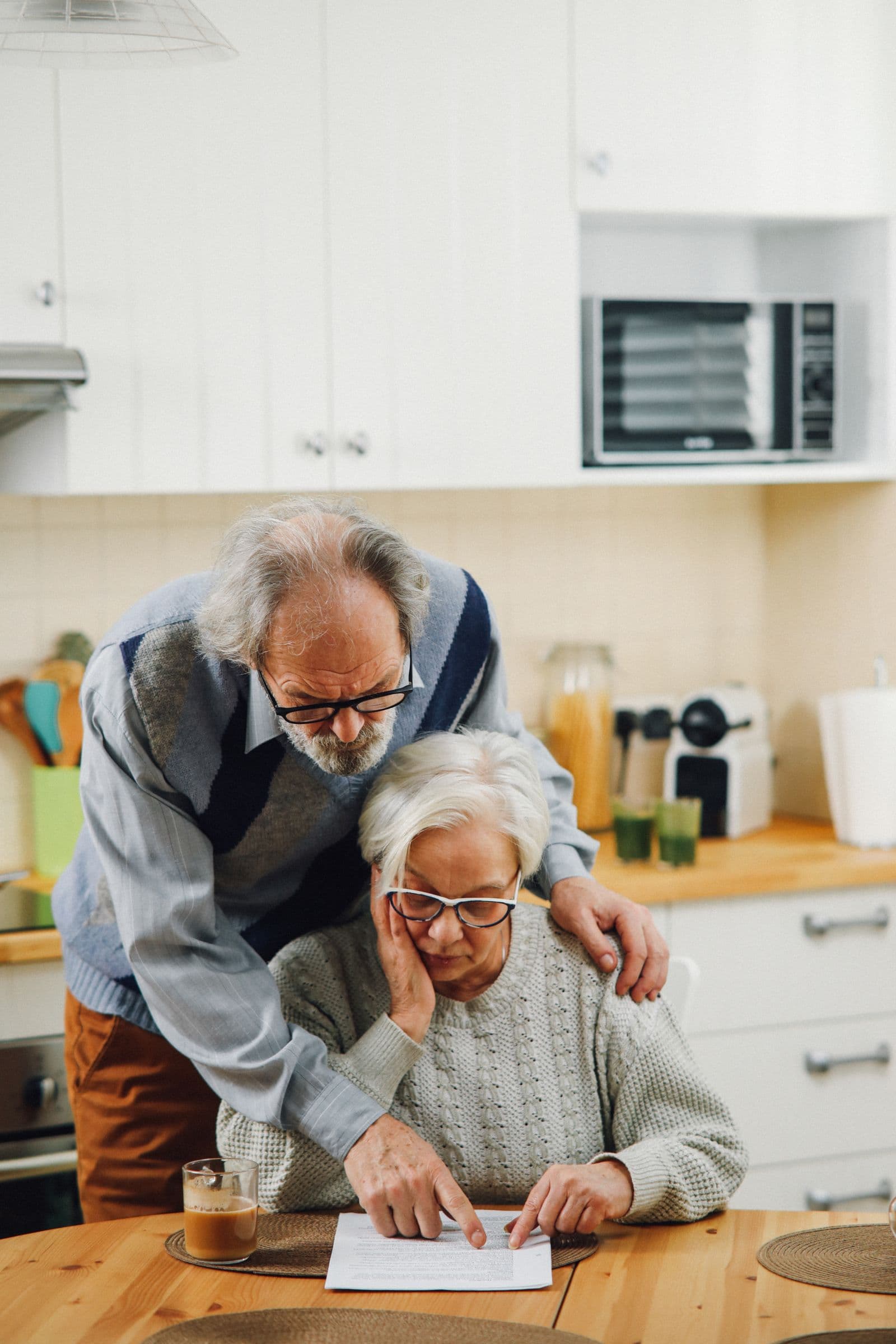 Specialist reviewing Medicare enrollment paperwork